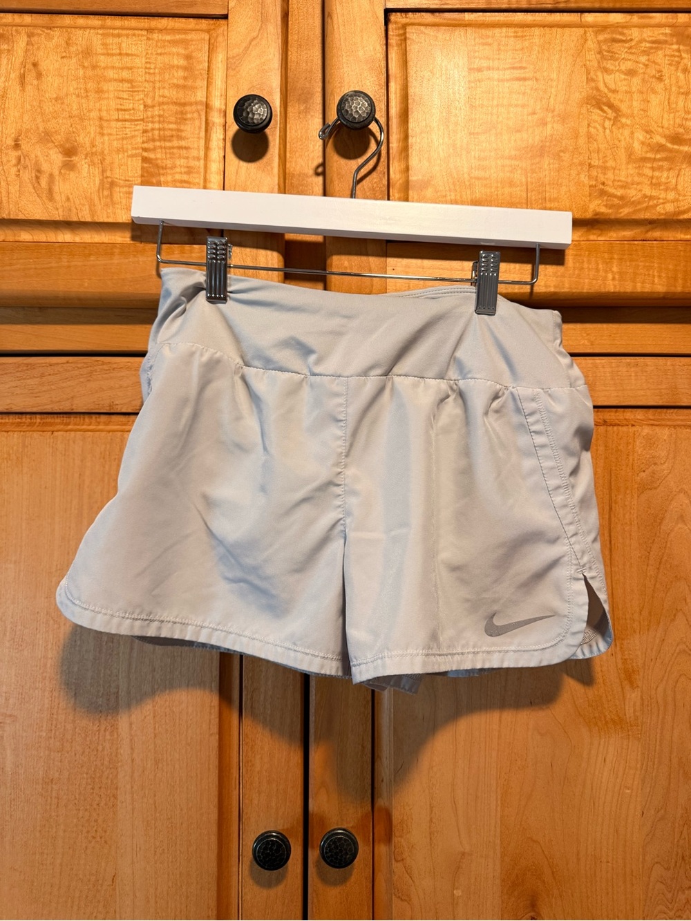 Nike Women's Light Gray Athletic Shorts with Subtle Swoosh